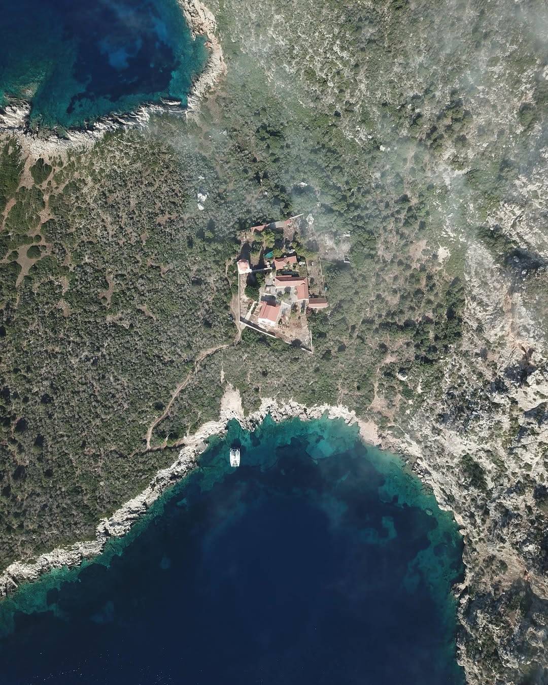 Alegria catamaran is anchored near the rocky coast of Proti Island in Messinia, Greece, surround (3)